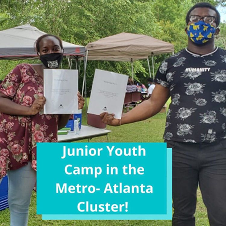 Two animators at a junior youth camp in Atlanta, Georgia hold up their study materials.