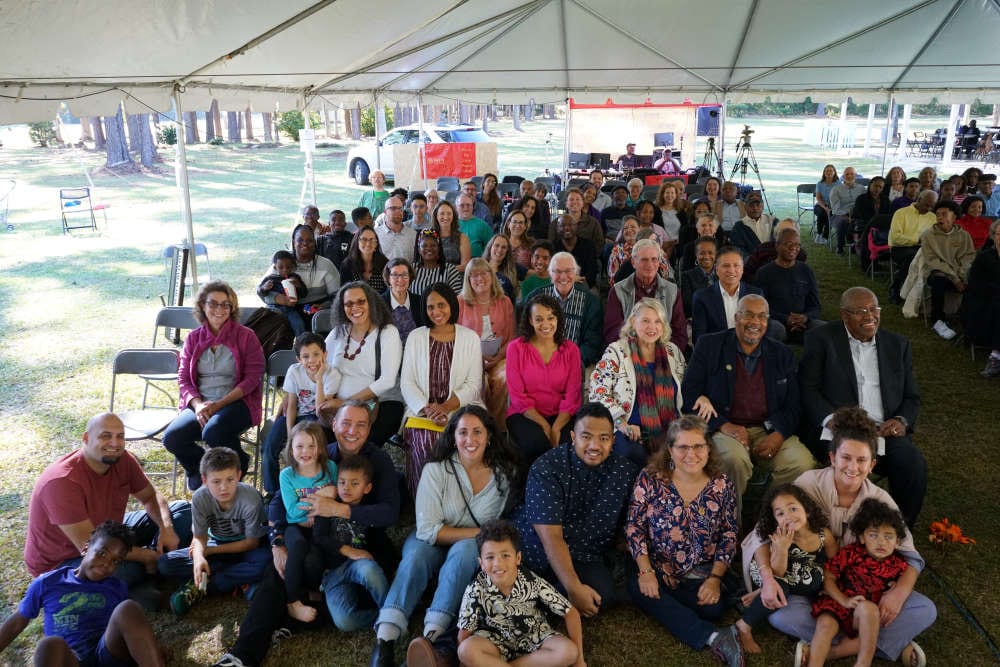 People gathered under a tent at the 50th Anniversary of Louis Gregory Baha'i Institute